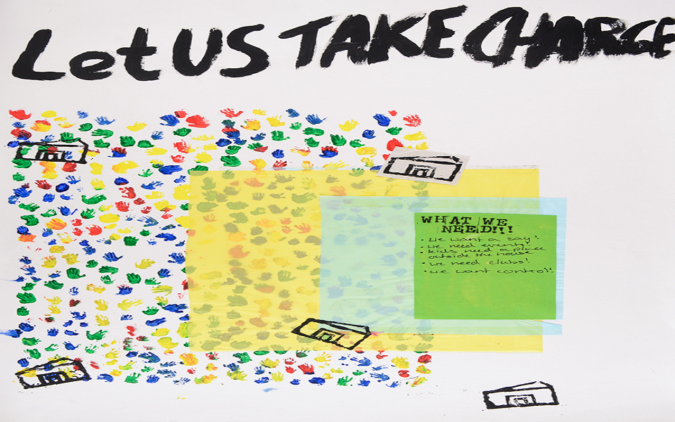 Young people's handprints and text: Let us take charge!