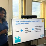 Young trainers in front of a SMART board