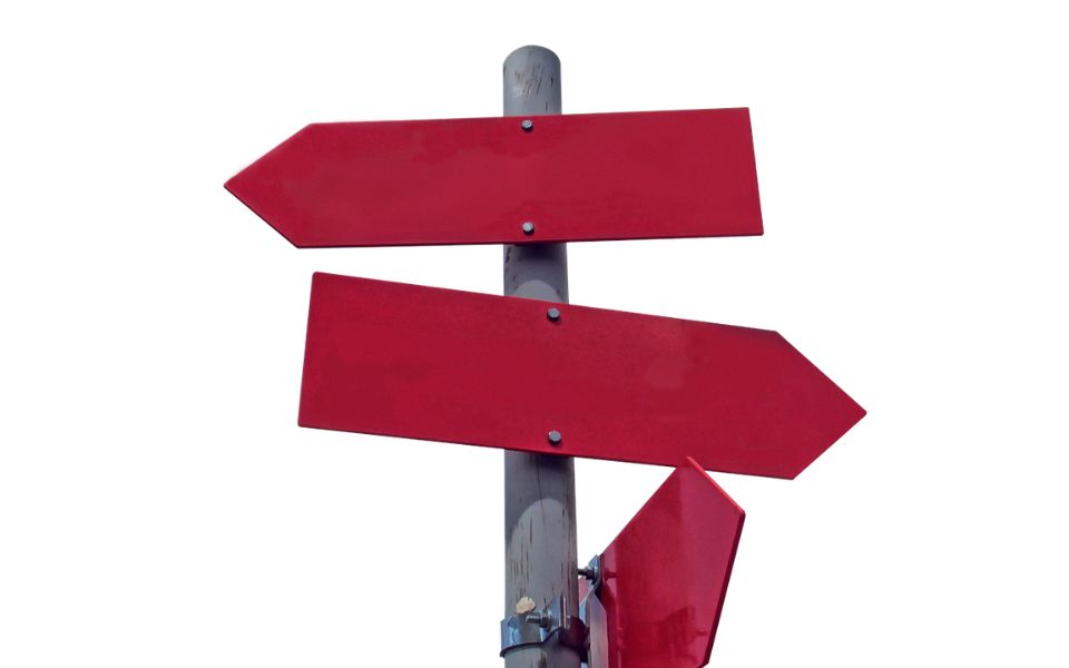 A signpost with red directional arrows pointing in different directions.